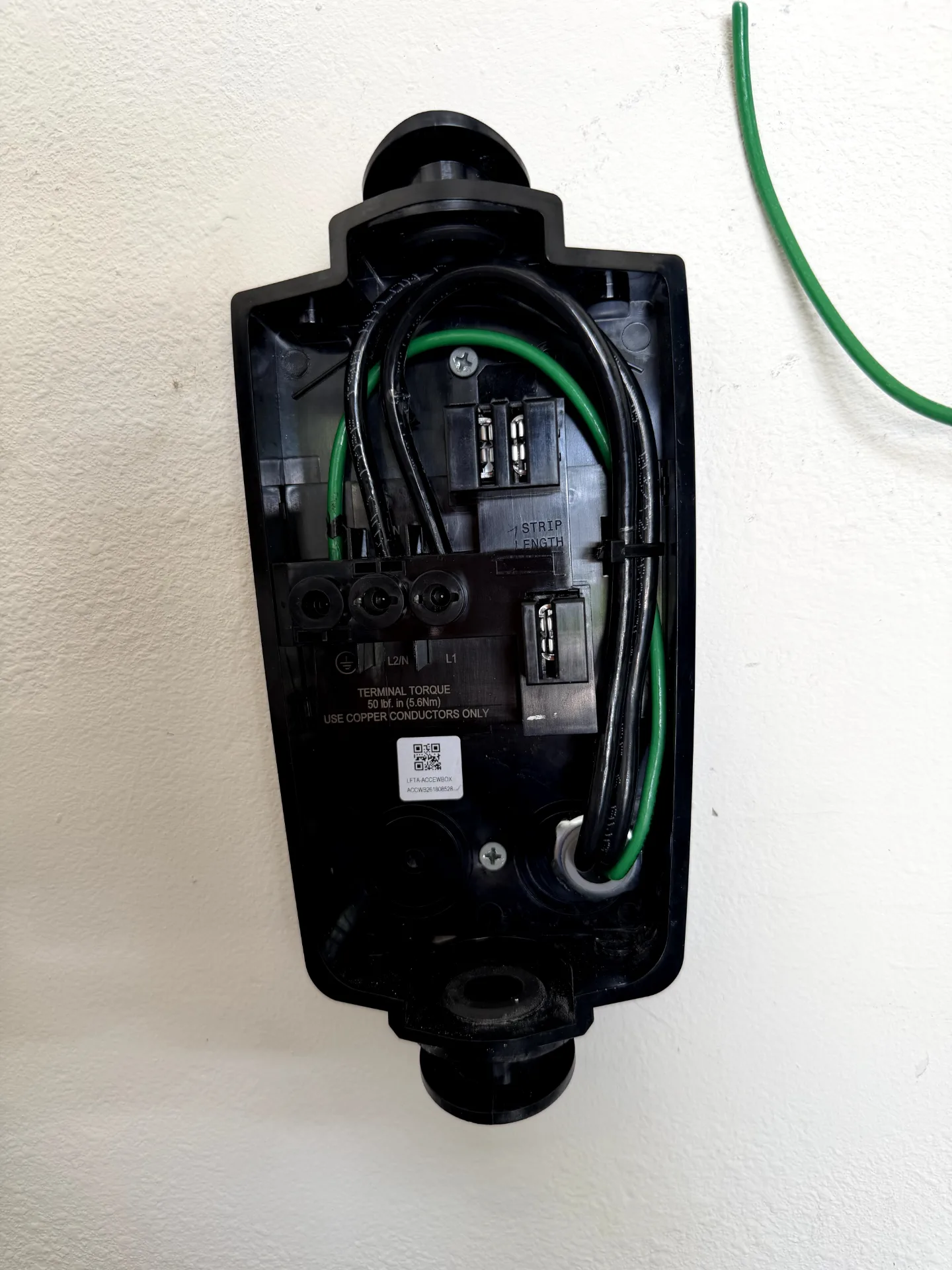 Licensed electrician installing a home EV charger in Florida